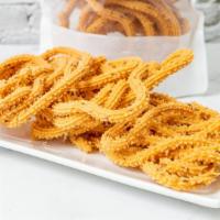 Muruku · Spicy savory consisting of crunchy twists made with rice flour and lentils. Key ingredients:...