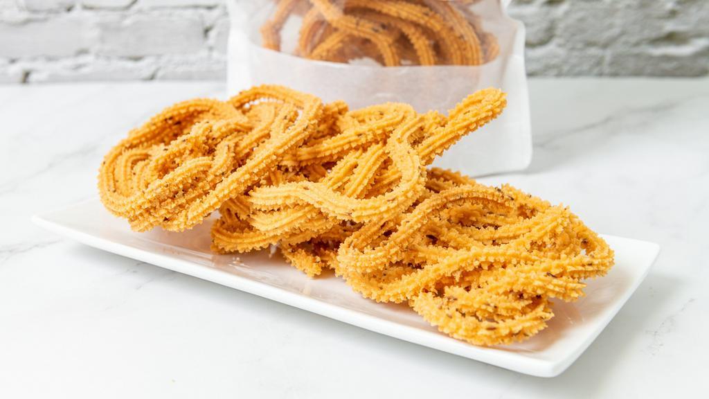 Muruku · Spicy savory consisting of crunchy twists made with rice flour and lentils. Key ingredients: rice flour, urad dal (black lentils).