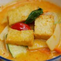 Red Curry · Thai spicy red curry paste simmered in coconut milk and bamboo shoots with your choice of me...