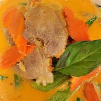 Duck Curry · Roasted duck cooked in spicy Thai red curry paste, basil, pineapple, tomatoes and simmered i...