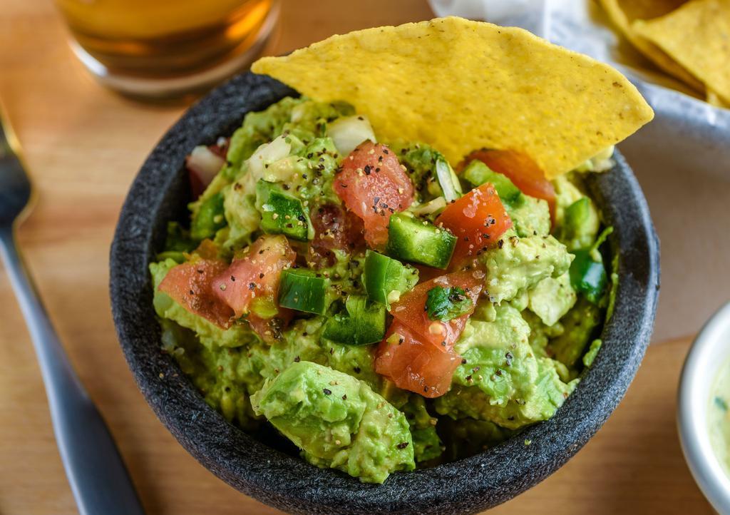 Guacamole Dip · Hand-scooped avocado with fresh jalapeño, fresh pico, zesty lime juice and warm fried tortillas.