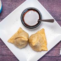 Fresh Vegetable Samosa · Two pieces. Two samosas filled with spiced potato, green peas wrapped in a thin layer of flo...