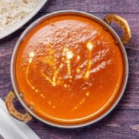 Butter Chicken Curry · Tandoori oven baked chicken cooked with onion, tomato and creamy sauce into authentic style.