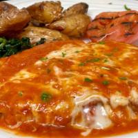 Pollo Alla Parmigiana · Antibiotic free chicken breast layered with eggplant and melted mozzarella with a light pomo...