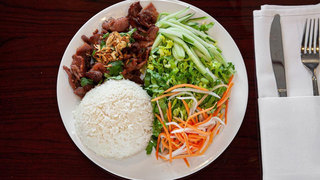 Noodles W/ Grilled Pork · Grilled pork with vermicelli noodles. Served with lettuce, cucumber, pickled carrots & radish, cilantro, fried red onions, and fish sauce on the side.