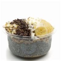 Almond Joy- Chia Bowl* · Chia pudding topped with blueberry flax granola, banana, coconut flakes, cacao nibs, and hon...