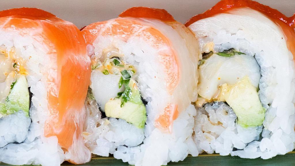 Tokyo Roll · Spicy escolar, cilantro and avocado in the inside, yellowtail and salmon on the outside. Drizzled with sriracha and ponzu sauce.