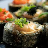 Black Panther Roll · Crab mix, avocado and cream cheese in the inside. Maki style tempura fried topped with mayo,...