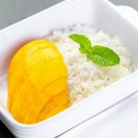 Mango With Sticky Rice · Sweet coconut sticky rice topped with slices of
fresh mango.
