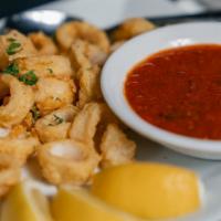 Calamari Fritti · Breaded tender fried calamari rings served with house marinara sauce.