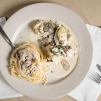 Chicken Jerusalem · Grilled chicken breast with sauteed mushrooms and artichokes in a white wine cream sauce.