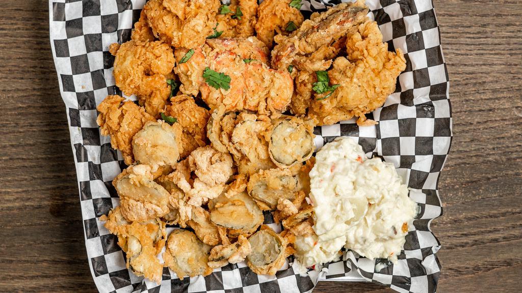 Deep-Fried Lobster Tail And Shrimp · Freshly breaded lobster tail & jumbo shrimp, marinated in house sauce, and deep-fried to a golden perfection.