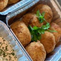 Crab Puppies · 3-all crabmeat (no filling) cakes rolled into a ball and fried like a hushpuppy. Served with...