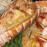 Stuffed Lobster · Crabmeat Stuffed Rock lobster, with crawfish rice, grilled shrimp and green beans.