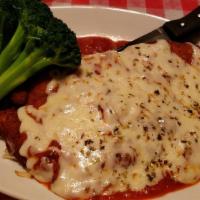 Chicken Parmigiana · Breaded chicken fried and then topped with mama sauce and mozzarella. Served with vegetable,...