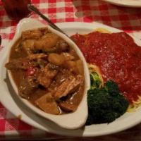 Chicken Pisano · Grilled chicken simmered in a brown gravy of sausage, potatoes and a hint of jalapeños. Serv...