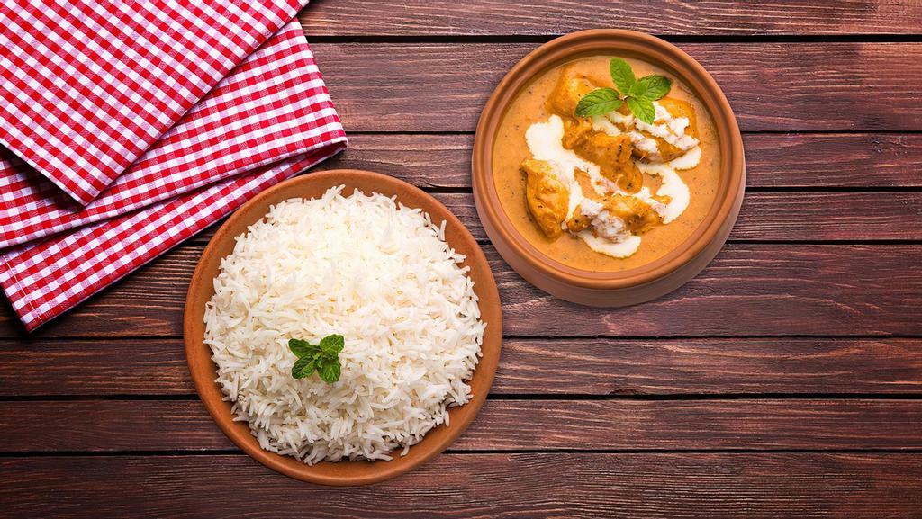 Creamy Butter Chicken Rice Bowl · A well flavoured and mildly spiced cooked chicken in tandoor and simmered in silky tomato gravy, flavoured in fenugreek served with fragrant Basmati rice