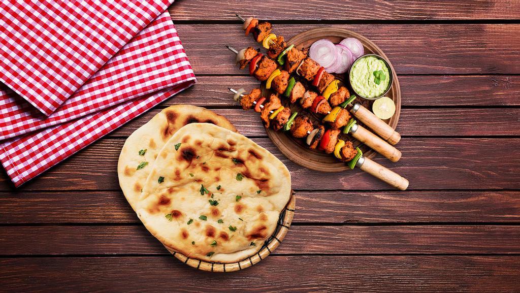Chicken Tikka & Naan Bread  · Combining the all-time favourite chicken tikka with herby mint chutney and healthy veggies, served with Naan Bread