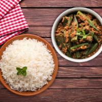 Okra Masala Rice Bowl  · A healthy dish made of okra, spices, onions & tomatoes stir fried and served with aromatic b...