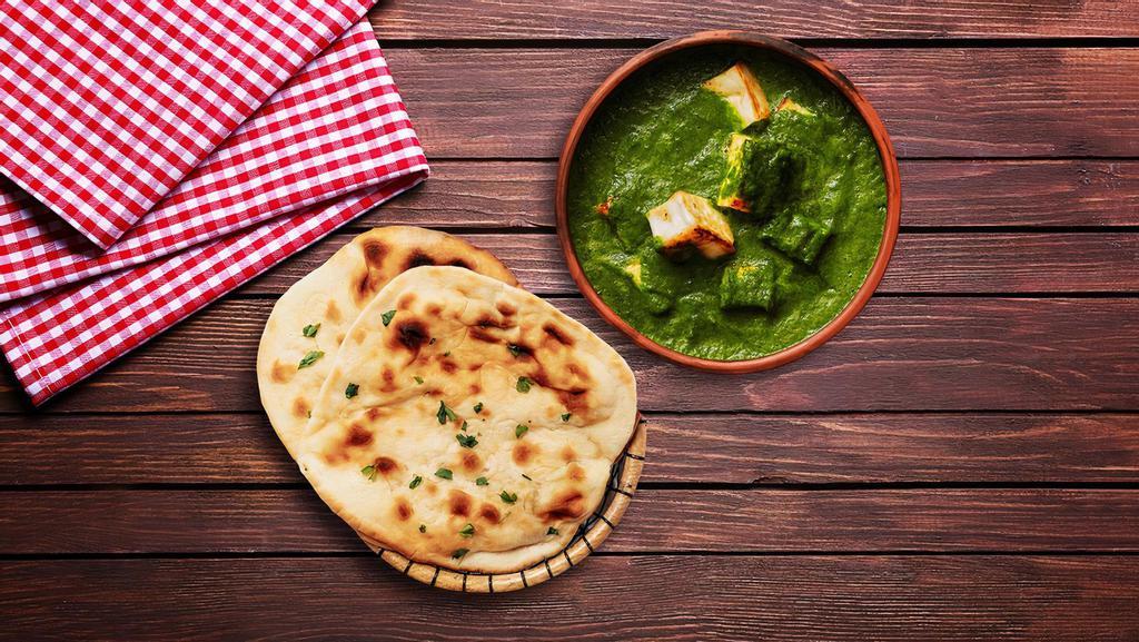 Spinach Cottage Cheese & Naan Bread · A flavourful yet spicy spinach curry with fresh chunks of cottage cheese, served with Naan Bread