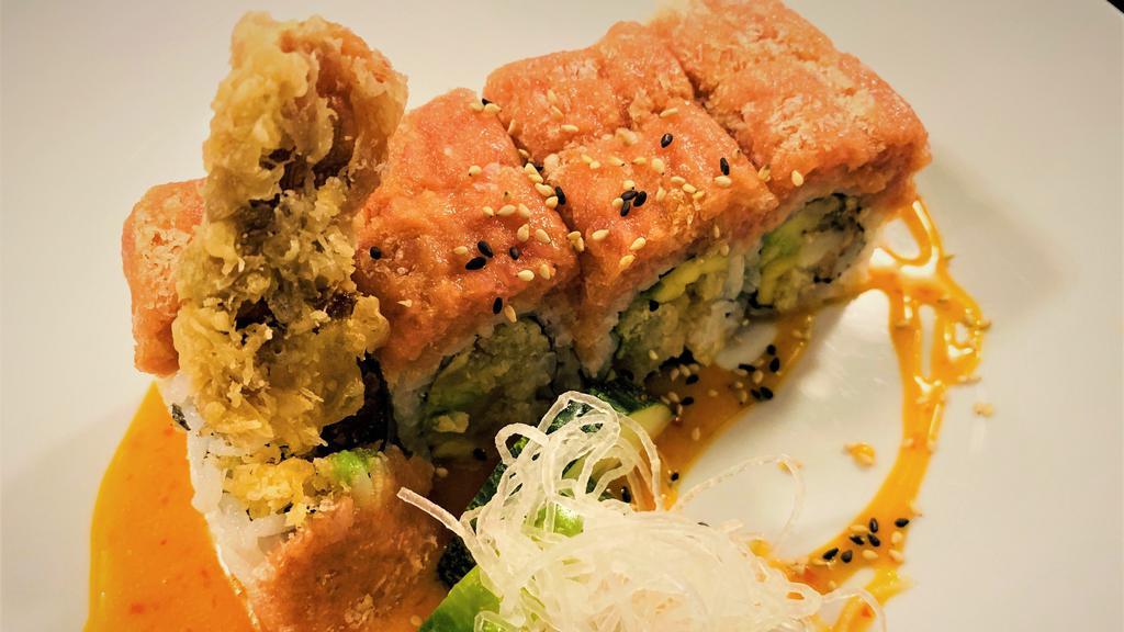 Lobster Dynamite Roll · Lobster tempura, mango, and avocado inside, topped with spicy tuna and sweet chili sauce.