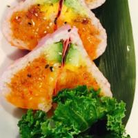Sweet Heart Roll · Spicy tuna, avocado, salmon mango inside wrapped with soy paper and sweet chili sauce.