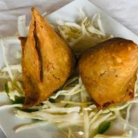 Veg Somosa · Crispy triangle pastry filled with potato and green peas.