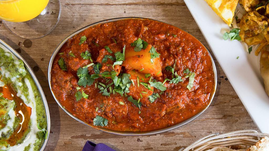 Lamb Vindaloo · Lamb cooked in spicy Kashmiri chilly sauce with potatoes.