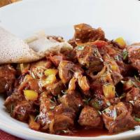 Awaze Tibs · Tender beef slices cooked in spicy berbere sauce with onion, jalapeno pepper. and Clarified ...