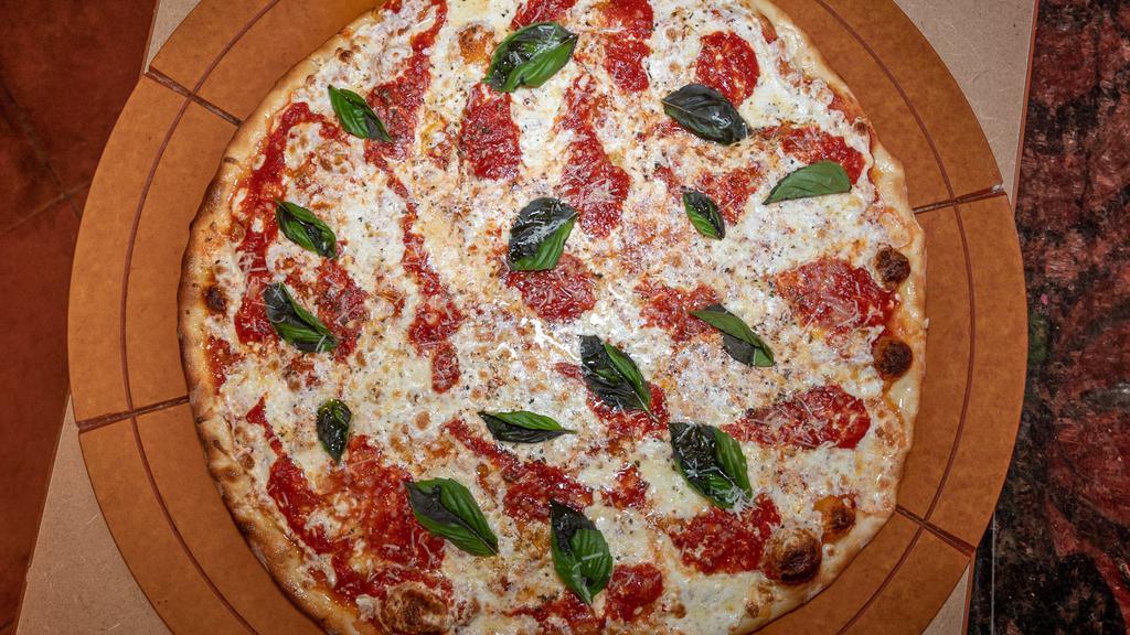 Margherita Pizza · Fresh mozzarella and basil on a thin crust (eight slices).