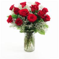  Petite Dozen Red Roses With Babies Breath In Vase · One Dozen (12) red roses are presented in a glass vase with accenting babies breath and gree...