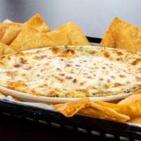 Spinach Artichoke Dip · Served with house made tortilla chips.