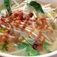 Pho Ga · Chicken noodle soup with chicken broth topped with shredded dark and white meat chicken. Top...