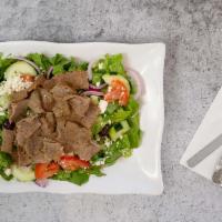 Gyros Salad · A hearty mixed green salad with fresh tomatoes, onions, cucumbers, feta cheese, kalamata oli...