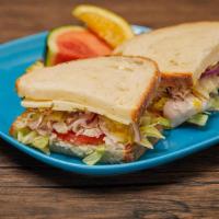 Turkey Deli Sandwich · Deli sandwich served cold with Mayo, Lettuce, and Tomato on your choice of bread. Topped wit...