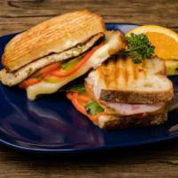Canadian Bacon And Chicken Panini · Seasoned chicken on Italian bread pressed with sweet pineapple rings, crisp red bell pepper,...