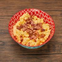 Mac N Cheese · Spiral noodles coated in a rich and creamy cheese sauce. Add chicken or bacon to really make...