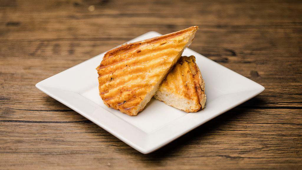 Garlic Bread · Italian bread, lightly toasted and served with garlic infused butter. For the cheese lovers out there, you can now choose our cheesy garlic bread! We top your garlic bread with aged parmesan prior to grilling.