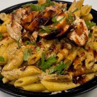 Jerk Chicken Alfredo Pasta · Juicy jerk chicken breast sliced then tossed with vegetables & penne pasta in our house made...