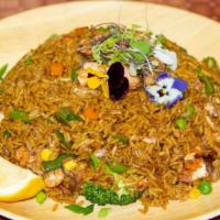 Jerk Salmon Fried Rice · Chunks of grilled jerk salmon is stir fried with rice & vegetables, this one pot meal is sim...