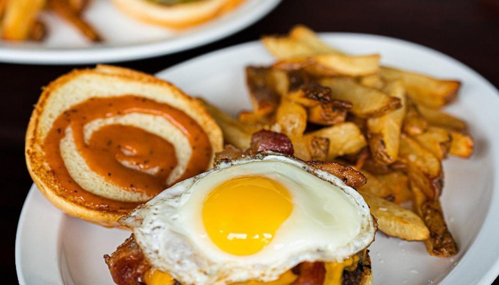 Q'S Sunny Side · Applewood Bacon, Sharp Cheddar, Fried Egg, Quincy’s Sauce