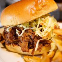 Pulled Pork · House made, Slow Roasted Pulled Pork piled on a Brioche Roll with BBQ Sauce. and Coleslaw