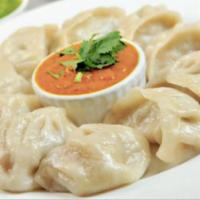 Momo · Typical nepali style chicken dumplings with fresh coriander, ginger, and garlic, steamed, an...