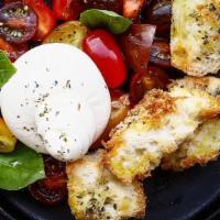 Burrata · Heirloom tomato, chargrilled bread, basil and extra virgin olive oil. Vegetarian. Nut free.