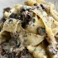 Pappardelle Ai Funghi · Mixed mushrooms, truffle cream and shaved truffle pecorino. Vegetarian.