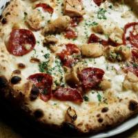 Porcina Pizza · Pizza in bianco, fior di latte, porcini mushroom, gorgonzola, hot salami and parsley. Nut fr...
