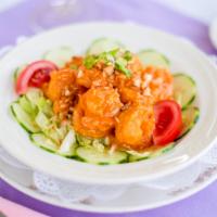 Spicy Shrimp · Lightly Fried, Tossed in a Chili Cream Sauce, Sweet and Spicy Cucumber Salad, and Crushed Ma...