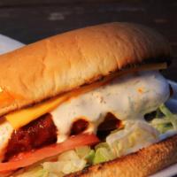 Buffalo Spicy Chicken Burger · Crispy chicken breast dipped in hot buffalo sauce with cheese, lettuce, tomatoes, and ranch ...