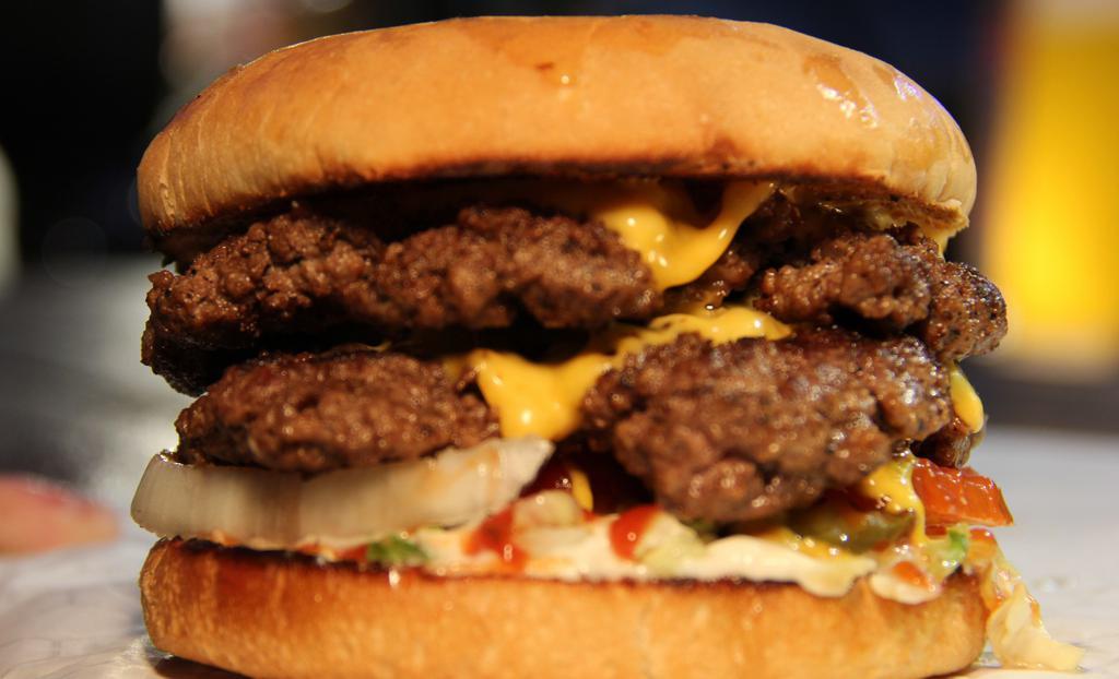 Double Cheeseburger · Two patties, double   cheese, tomatoes, lettuce, pickles, ketchup mustard and mayo.