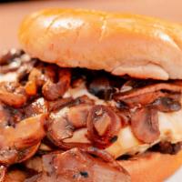 Mushroom Swiss Burger · Ground beef, melted swiss cheese topped with grilled onions, and mushrooms.